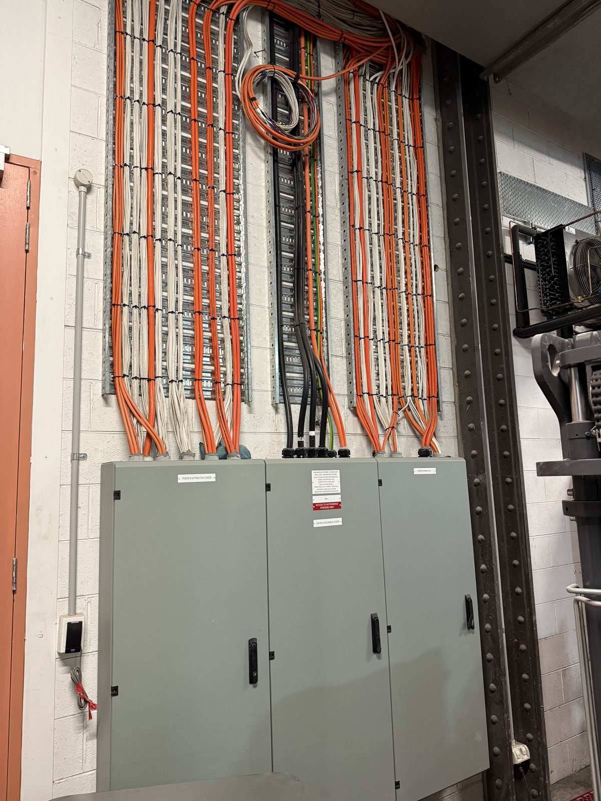 Commercial switchboard with organized cable runs by Carlin Co Electrical Melbourne