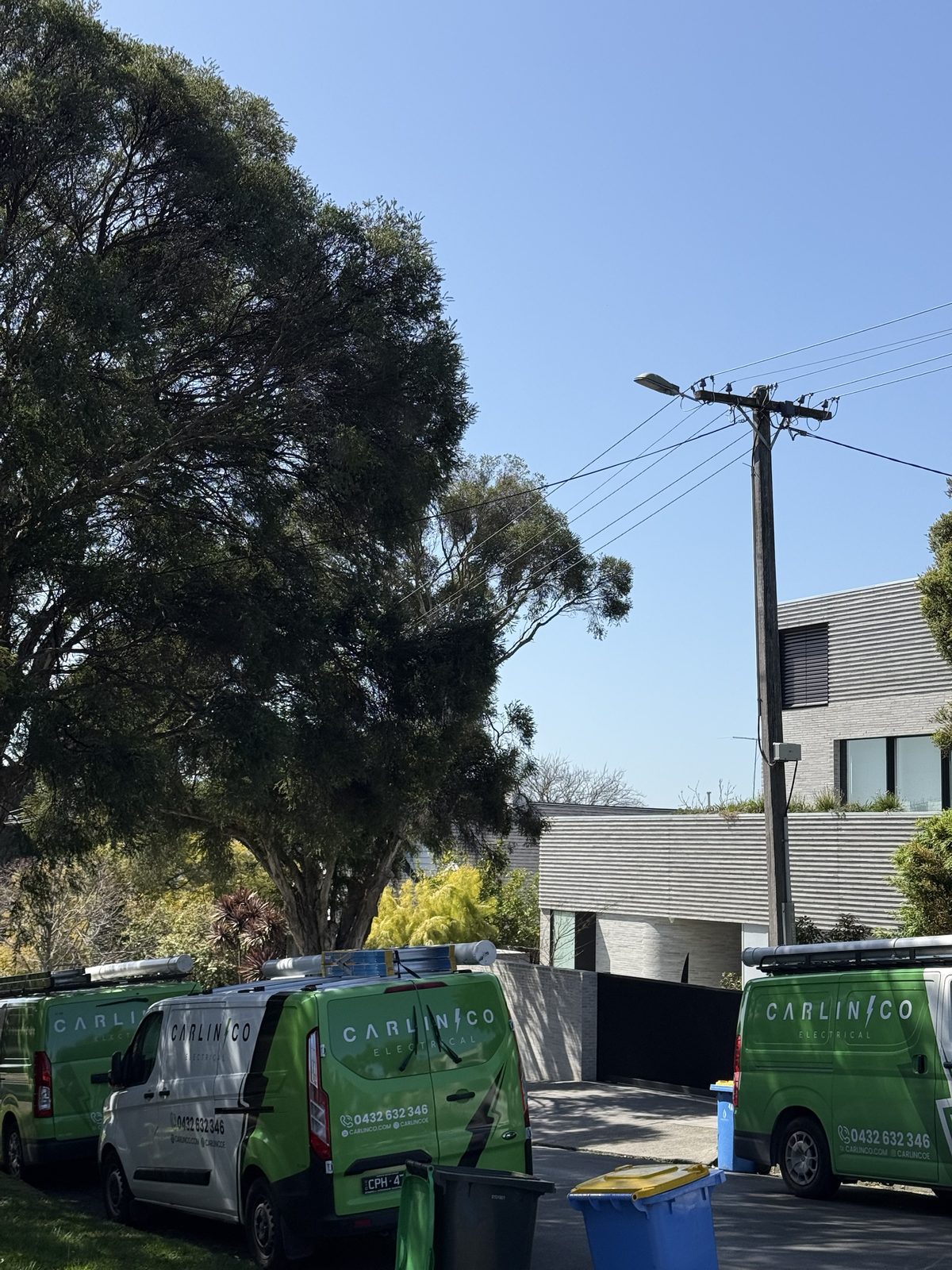 Carlin Co Electrical vans on site for three-phase sauna installation in Kew Melbourne