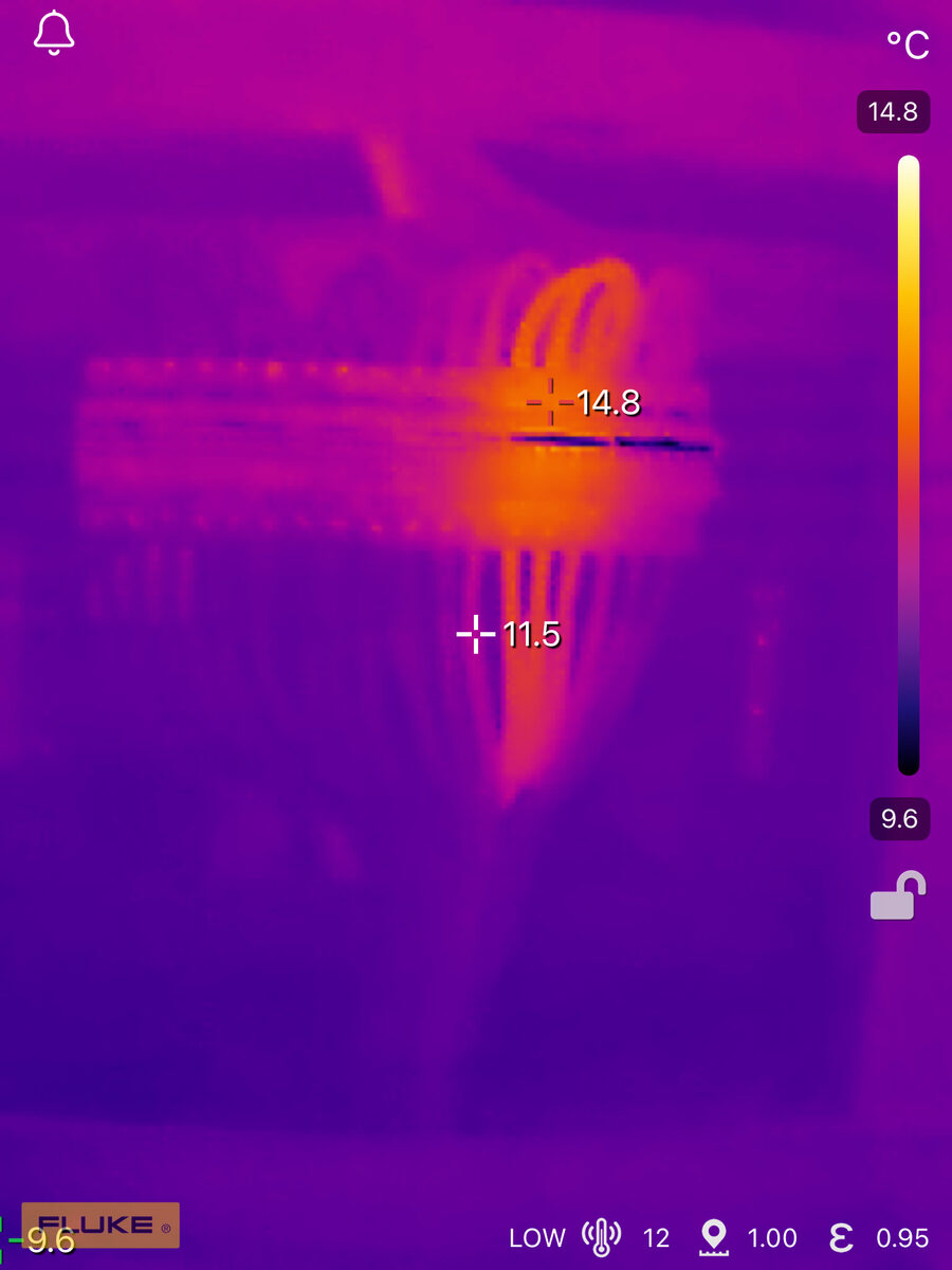 Thermal image of circuit breaker connections showing temperature differential at 14.8 degrees and 11.5 degrees indicating connection integrity
