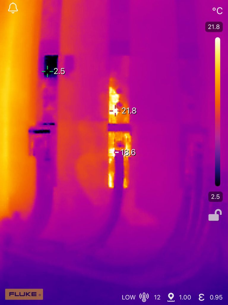 Fluke thermal camera identifying hotspots in an electrical distribution panel during routine inspection